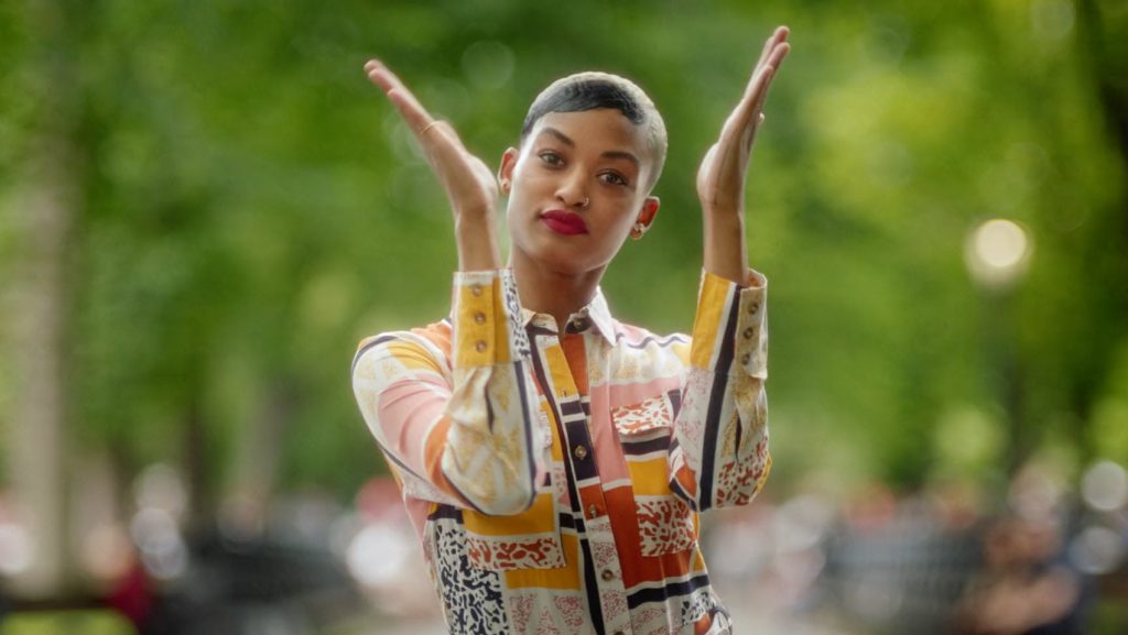 A model claps her hands in a still from Anthropologie's Season Premiere ad